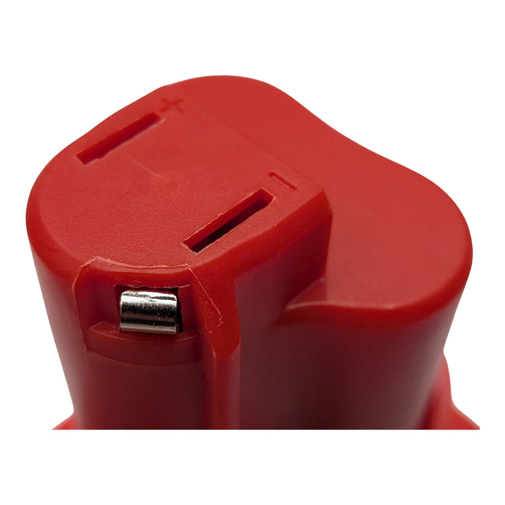 Einhell 18V PXC to Milwaukee M12 battery adapter - close-up of the tool-side head with two terminal slots and a + mark