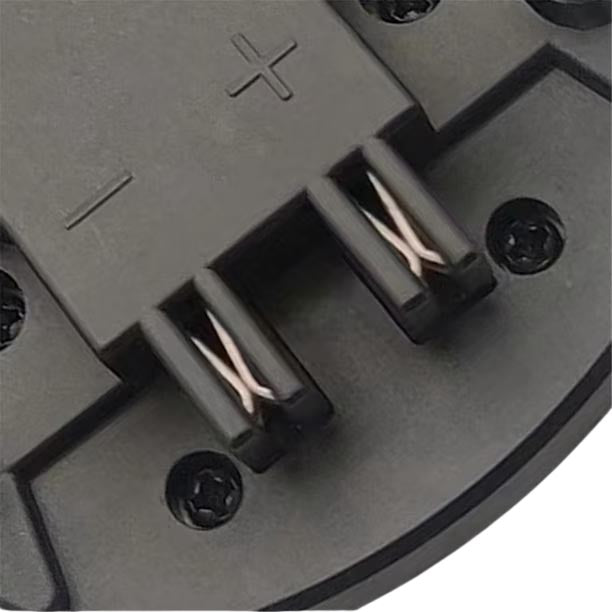 Hilti 22V to Bosch 18V GBA (Blue) battery adapter - close-up of the battery-side contacts and their polarity marks